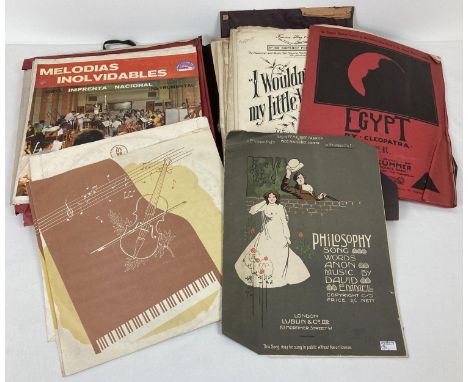 A collection of assorted vintage records and sheet music. 