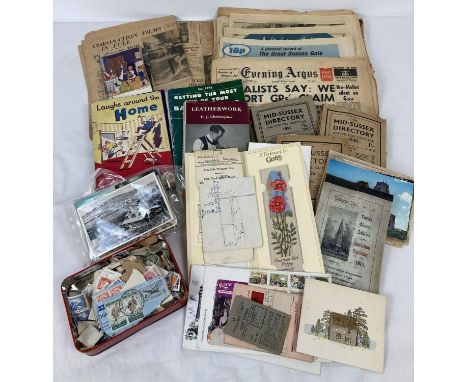A quantity of assorted vintage ephemera to include stamps, postcards, newspapers &amp; books. Lot includes: newspapers dating