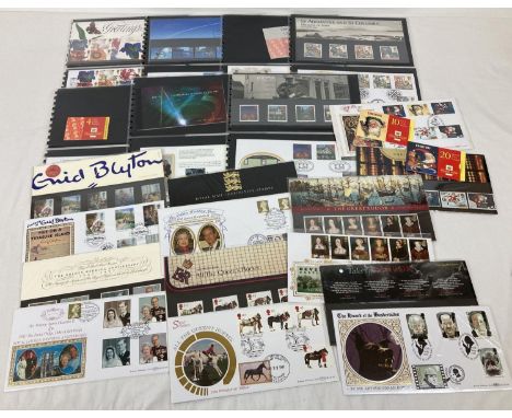 A collection of 14 Royal Mail collectors mint stamp sets or stamp books complete with corresponding first day covers, all dat