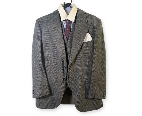 A tailored woolen grey three piece suit, a shirt by 'Williams and Gill' of Manchester, a tie, suspenders and pocket handkerch