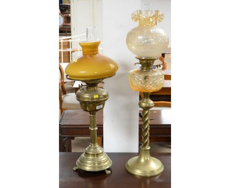 A Victorian brass oil lamp, with moulded glass reservoir, approximately 83cms high including shade and funnel; together with 
