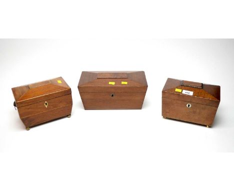 A 19th Century walnut tea caddy, with lion head ring pull twin handles, raised on gilt ball feet, 19 x 13cms high; together w