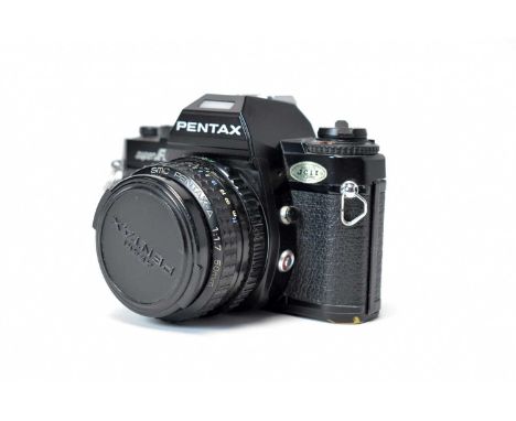 A Pentax Super A SLR camera fitted SMC 50mm f1.7 lens.