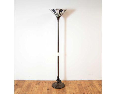 A reproduction Tiffany style standard lamp, the Art Nouveau style polychrome shade atop a reeded column with acanthus collar,