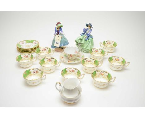 A Coalport floral decorated tea service, with floral bouquets within green batwing borders, comprising ten cups and five sauc