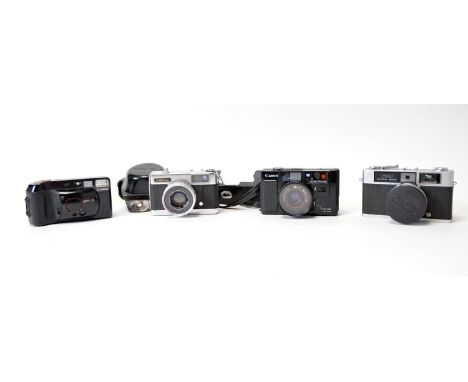 A Canon AF35M auto focus camera; a Canon Sure Shot Supreme camera; a Ricoh 35S rangefinder camera; and a Yashica EZ-Matic 4 c
