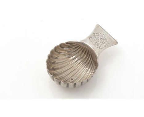 A George III silver caddy spoon, in the form of a scoop with a deep, fluted bowl and a lug handle, initialled, unmarked, poss