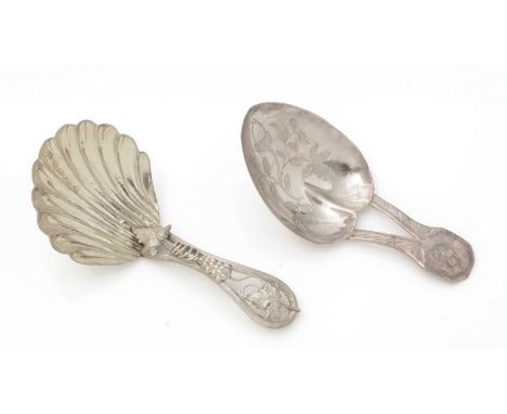 A Victorian silver caddy spoon, with a fluted shell bowl and a wirework stem with applied grapes and vine leaves, initialled 