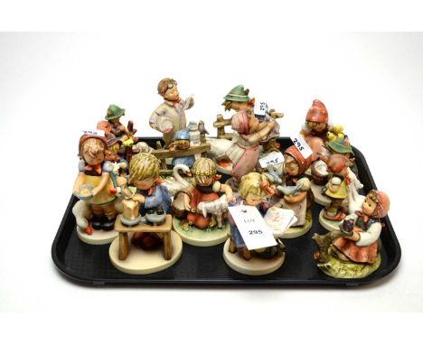 A collection of Goebel Hummel figures of children, including: a girl with a lamb; a girl with geese; a girl with a basket of 