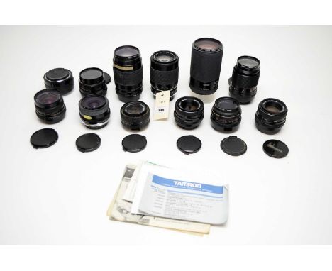 A selection of camera lenses, including: a Carl Zeiss Jena f3.5 135mm lens; a Sigma f4-5.6 70-210mm zoom lens; a Pentacon Pra