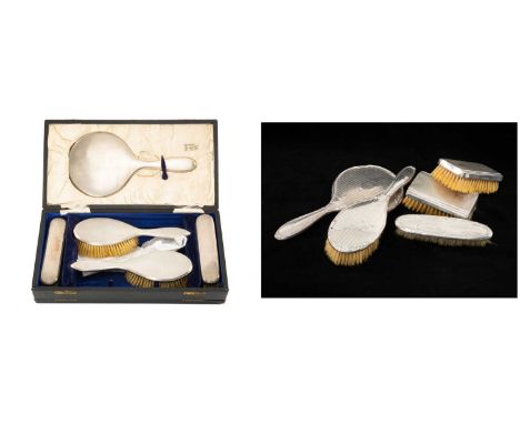 SILVER DRESSING TABLE WARES comprising boxed engine turned dressing table set comprising mirror, four brushes and comb, Birmi