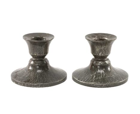 PAIR OF LIBERTY & CO. 'TUDRIC' PEWTER DWARF CANDLESTICKS, shape 01543, planished finish, 8cms (h) (2)Provenance: private coll