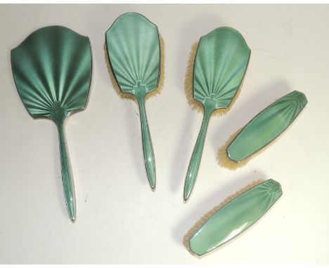 A George VI silver and green enamel dressing table set comprising two hairbrushes, two clothes brushes and a hand mirror, Bir