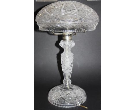 An early 20th Century cut glass mushroom lamp.  A domed circular base rising to a cropped stem, leading to a silver plated th