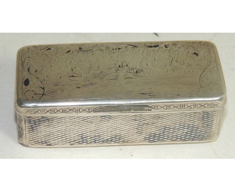 A Russian silver niello work snuff box, the lid and base decorated with village scenes, the inside of the hinged lid engraved