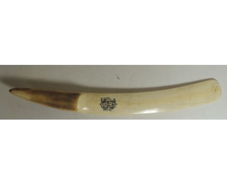 A Victorian carved tusk page turner engraved with initials, 43cms long 
