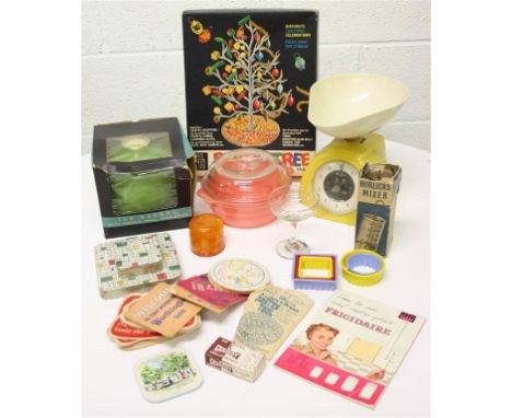 A collection of 1950's and 1960's kitchenware items; comprising of place mats, coasters, kitchen scales, a boxed pantry tree 