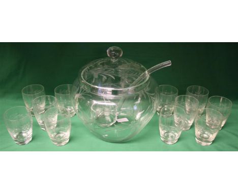 A cut crystal covered punch bowl with ladle and eleven glasses.  Decorated with berries and leaves.  Glasses 10cm high.  