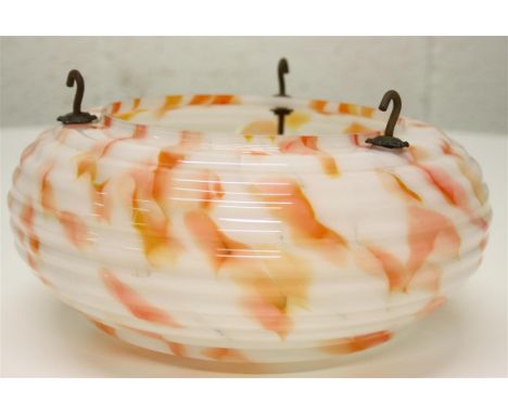 An Art Deco glass ceiling light; with an orange marble-effect pattern.  26 cm diameter.