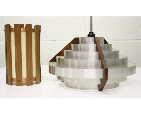 A 1960's aluminium and wood ceiling light; of stepped form.  35 cm diameter.  To include a cylindrical ceiling light, with co
