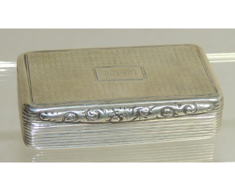 A William IV silver snuff box with foliate thumb piece, reeded sides, the cover engraved with initials, Birmingham 1830, make