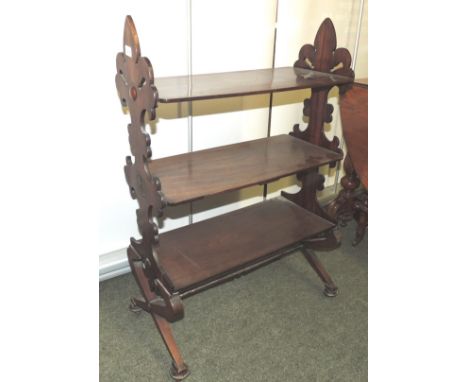 A 19th Century rosewood free standing shelf unit/whatnot having shaped end supports and three rectangular shelves, 61cms wide