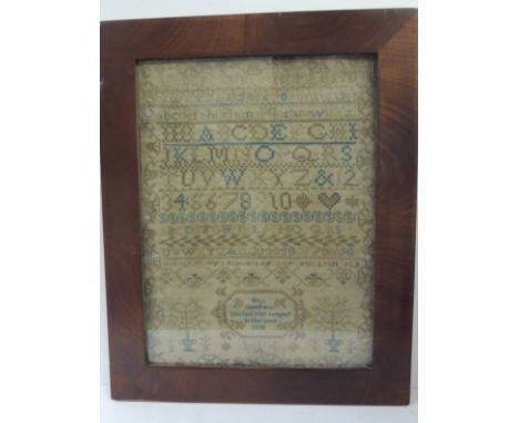 An early 19th Century sampler worked with coloured thread on coarse ground with rows of alphabet, numbers, decorative borders