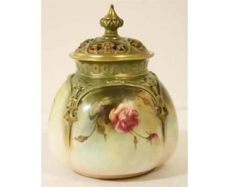 A Royal Worcester lidded pot; of squat form, with pierced detail to the lid.  Decorated with hand-painted roses and gilt deta