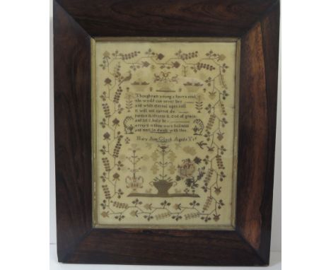 A 19th Century sampler worked in coloured thread on fine ground with central verse, bowls of flowers stylised floral border, 