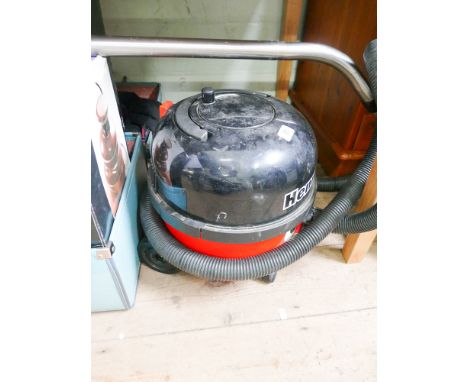 A Henry cylinder vacuum cleaner with pipe and tube