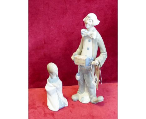 Lladro figurine of a kneeling girl and a similar Spanish figurine of a kneeling girl and a similar Spanish figurine of a clow