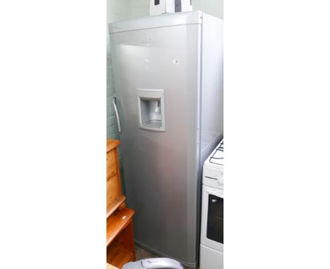 A large Beko refrigerator and silver cabinet 