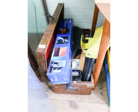 A tin trunk, tri-pod, tennis rackets, wheel lock etc