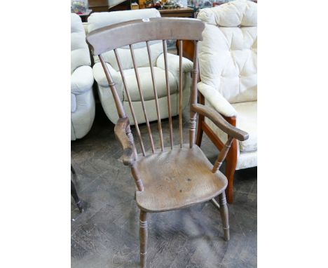 A Windsor farm house style stick back elbow chair 