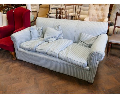 An Edwardian three seater sofa with feather upholstery 