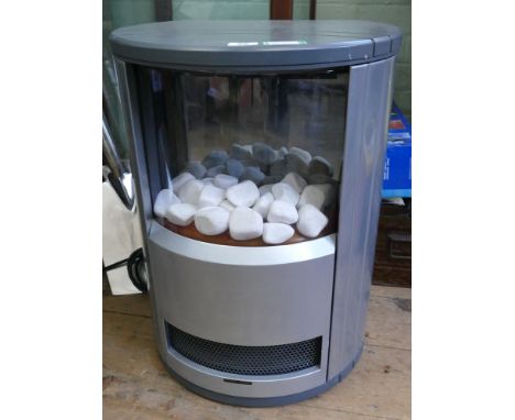 A circular electric heater with Whitestone effect in silver case