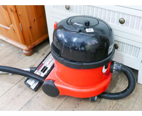 A Henry cylinder vacuum cleaner with pipe and tube