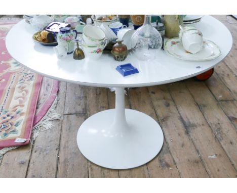 A circular white dining table on metal pillar base - diameter approx 42"     Condition - base good.  Clean condition.  No dam