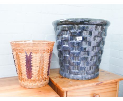 A large dark green glazed plant pot, assorted modern dolls house furniture in wicker basket