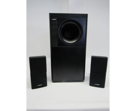 A Bose Acoustimass 5 Series III speaker system, comprising subwoofer and pair of satellite speakers, with instruction manual 