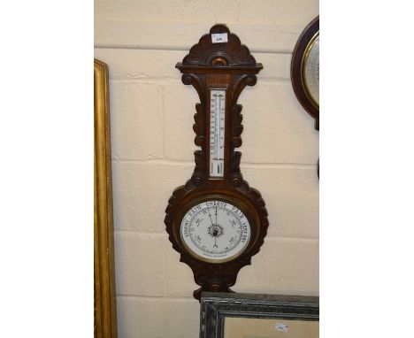 Late 19th Century barometer and thermometer combination in carved frame