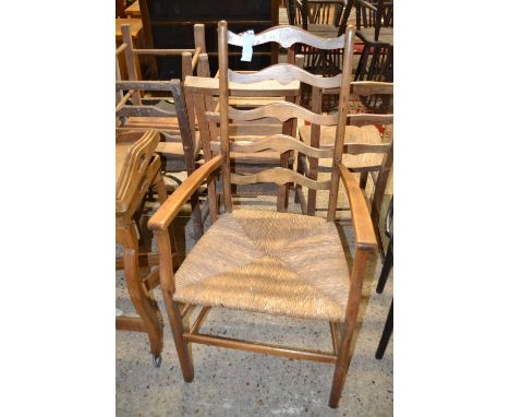 A rush seated ladder back carver chair
