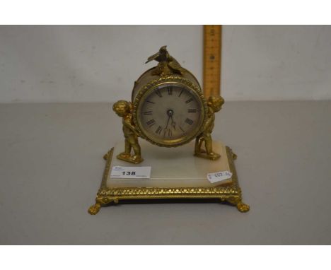 Small 20th Century French brass and marble based mantel clock with cherub mounts