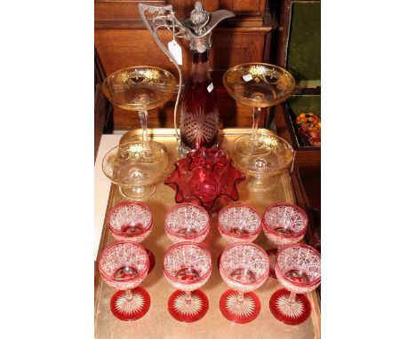 Two pairs of clear and gilt decorated glass sundae dishes, ruby glass carafe, eight glasses and sugar and cream.