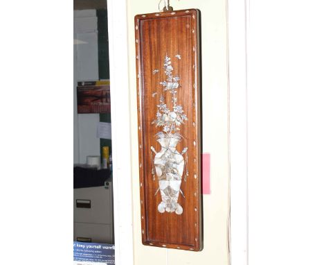 Pair Oriental rosewood and mother of pearl inlaid wall plaques depicting vases of flowers, 61cm by 16.5cm.
