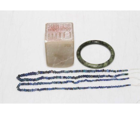 Green jade Chinese bangle, large soapstone seal and two Lapis Lazuli bead necklaces.