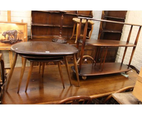 Ercol two tier book trolley and nest of three pebble tables.