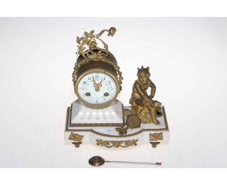 Gilt metal and marble mantel clock with mounted cherub.