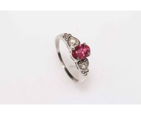 Oval ruby and white stone ladies dress ring set in 9 carat white gold, size P.