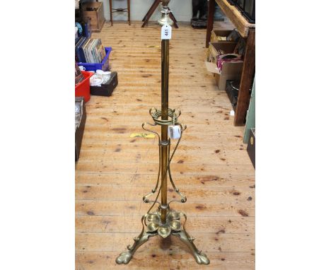 Art Nouveau style brass triform standard lamp.